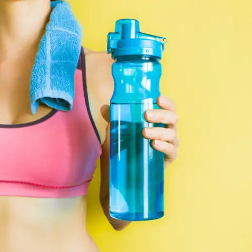 Bright turquoise plastic water bottle for staying active and staying hydrated during holiday season.