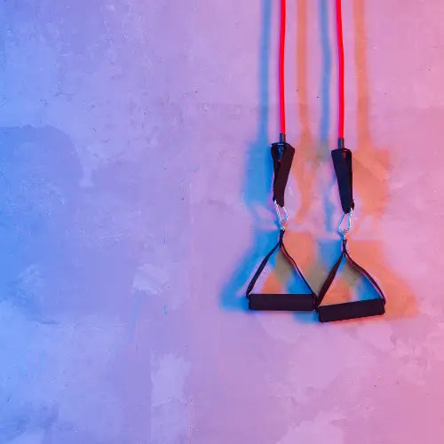 Suspended exercise straps with triangular handles for staying active during the holiday season.